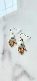🧿 Aretes Hamsa con Ojo Protector – Protección, Equilibrio y Luz Espiritual