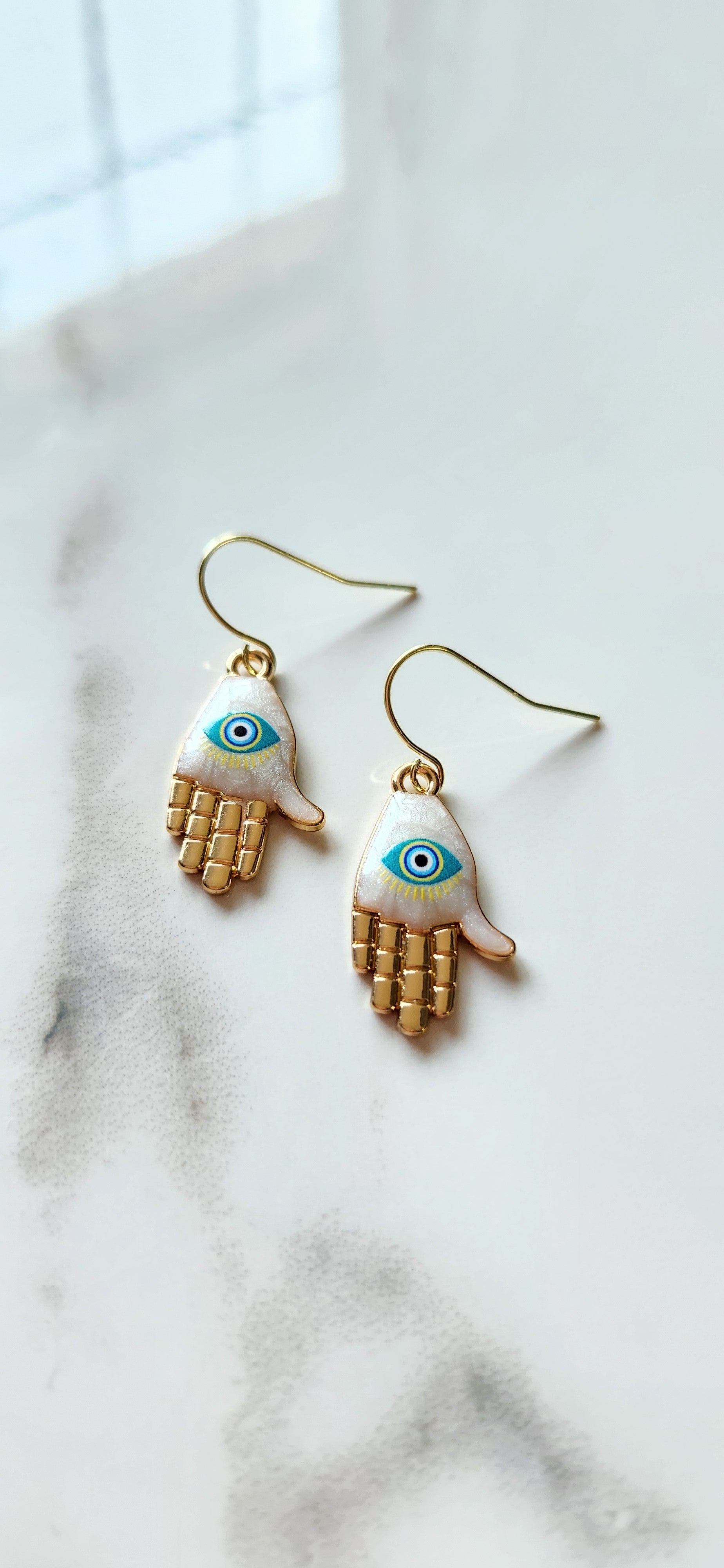 🧿 Aretes Hamsa con Ojo Protector – Protección, Equilibrio y Luz Espiritual